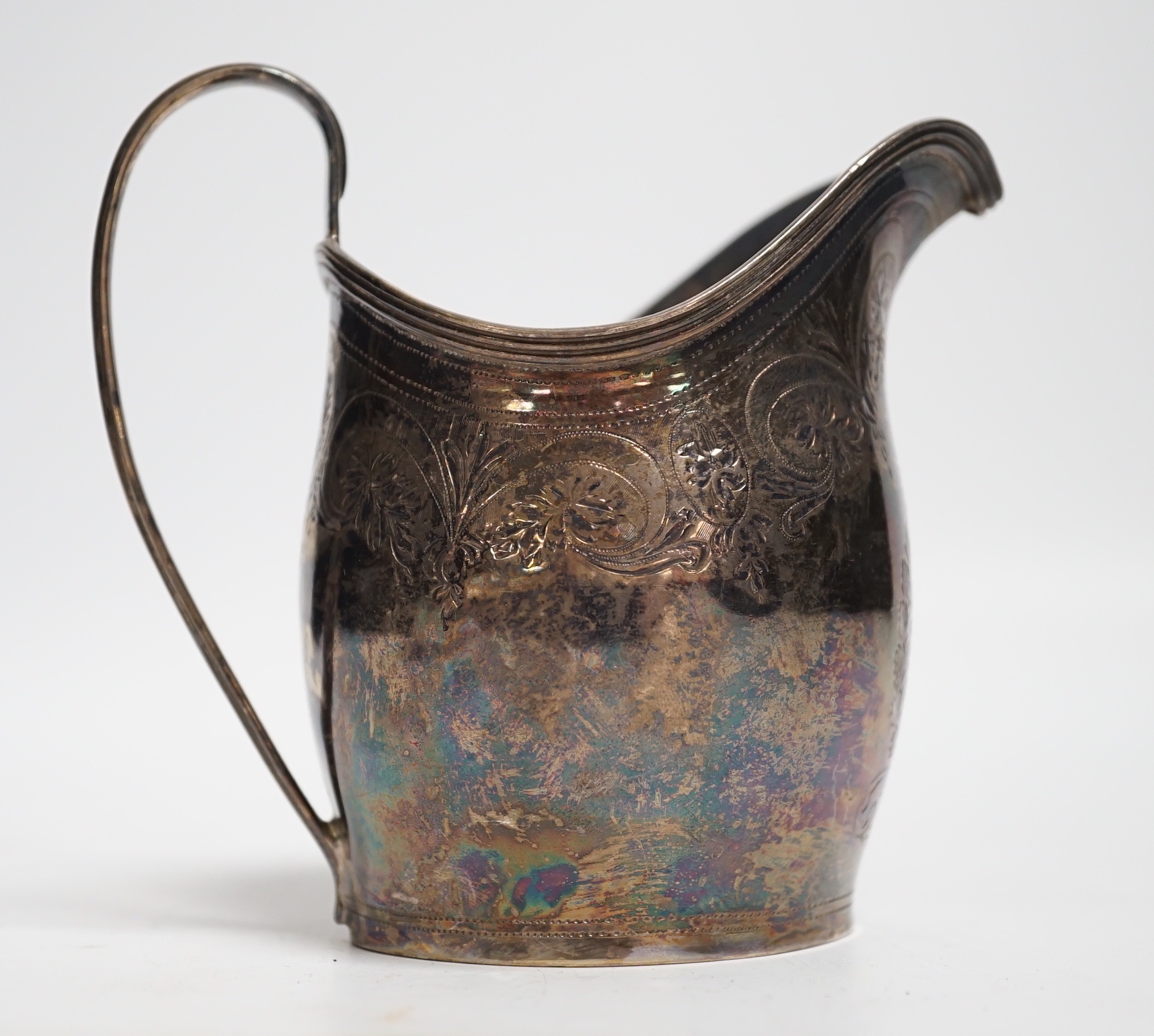 A George III engraved silver helmet shaped cream jug, London, 1799, 10.4cm, 3.2oz.